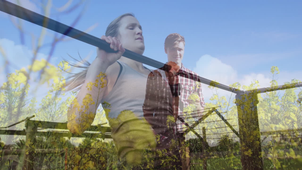 Exercising with barbell, woman overlay animation on man walking in field