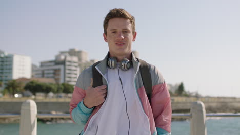 portrait-of-cheerful-young-man-smiling-happy-on-sunny-beachfront