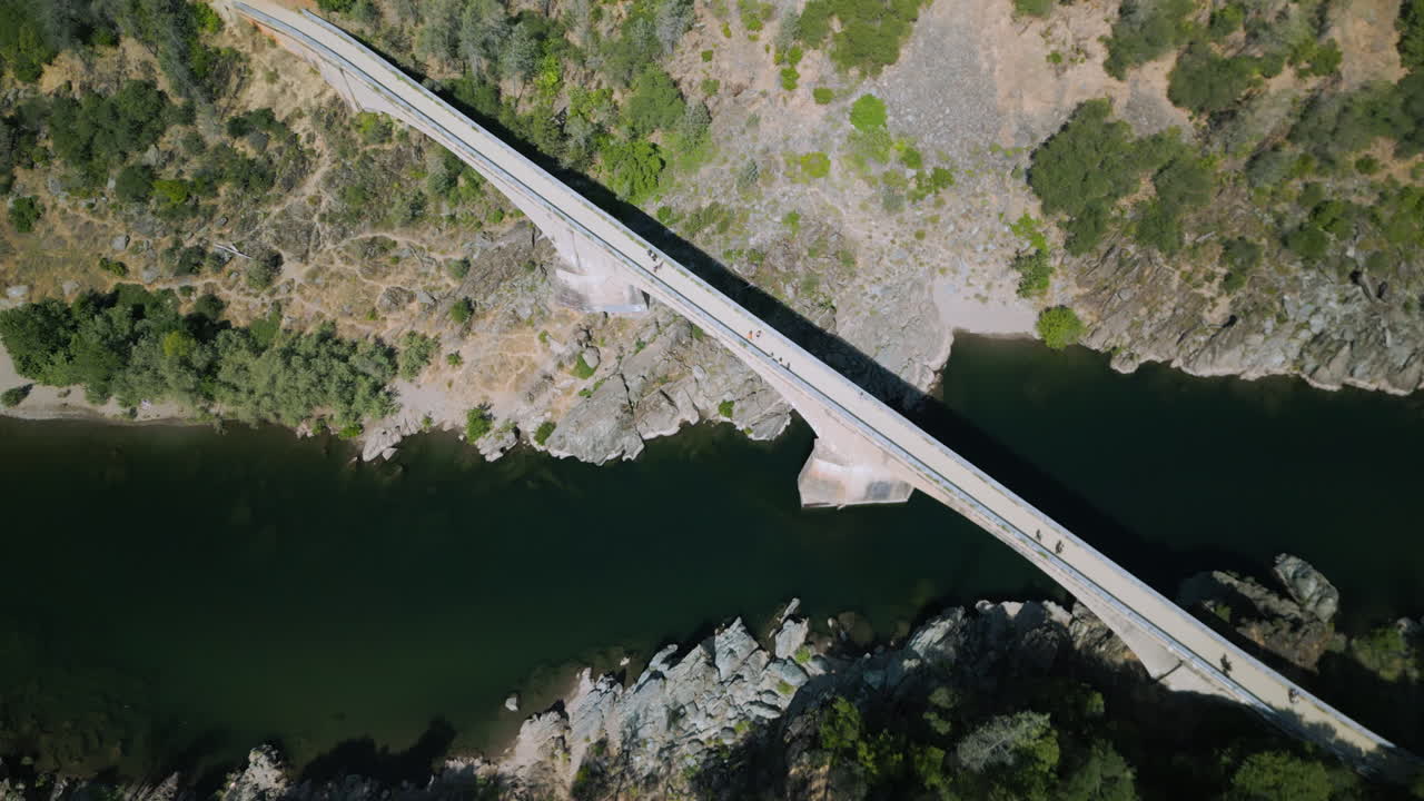 Aerial drone footage flying over trails in Auburn, California. Bird's eye view of walkers in Sierra Nevada mountains. Perfect for nature documentaries and California travel content