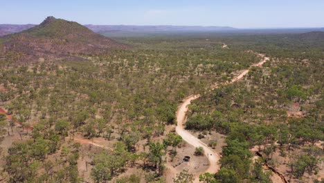 Rural-dirt-track-drone-aerial-near-The-Savannah-Way,-Queensland,-Australia