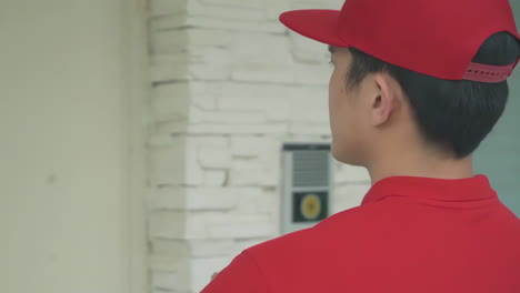 delivery man uniform smiles during express, courier holding a small package parcel delivering goods to customer's home with van truck, door-to-door services