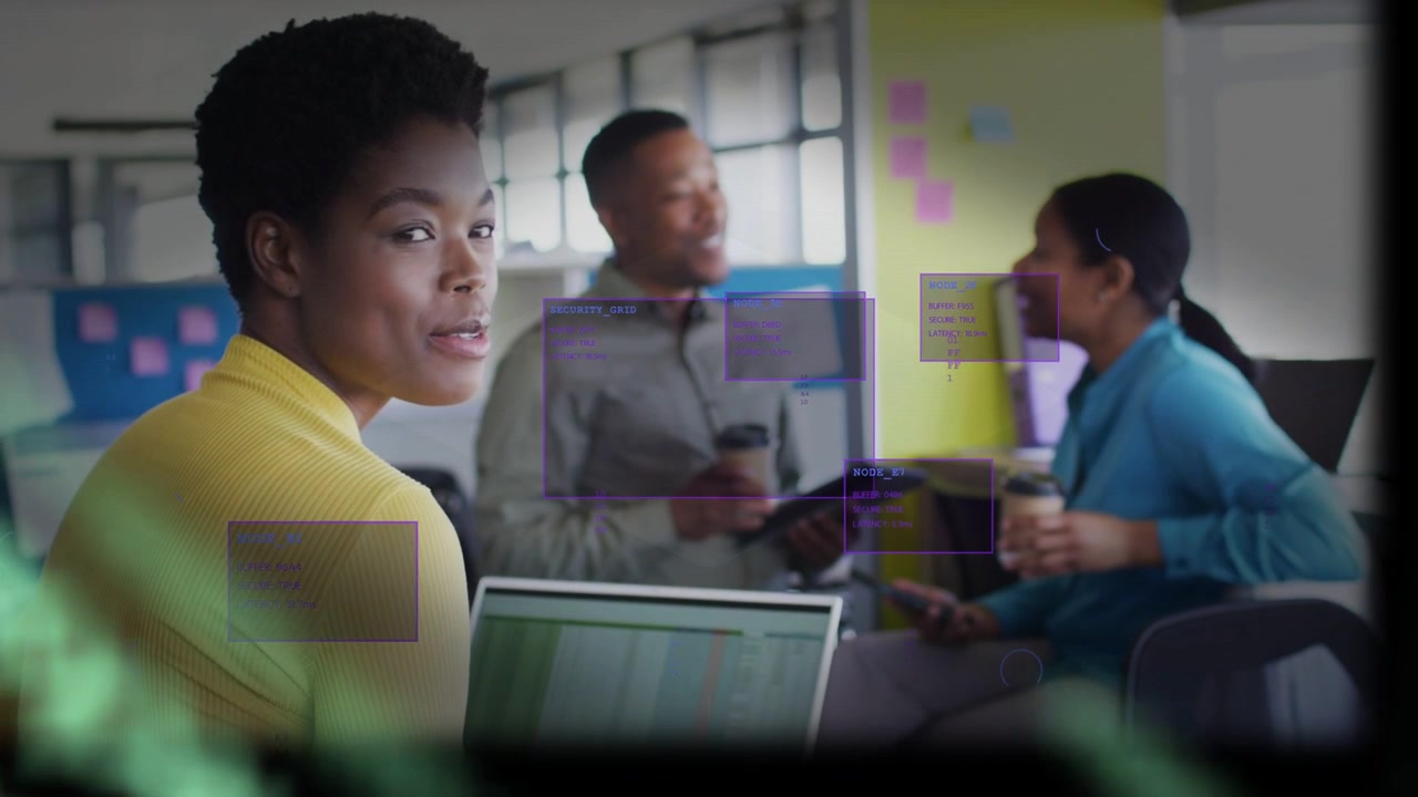 Vertical video: lead woman speaking at laptop, causing purple UI boxes and guiding office team