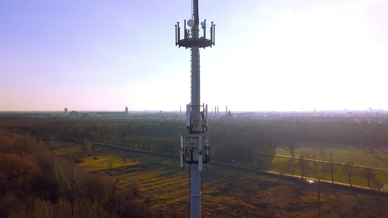 drone ascending in front of an antenna mast