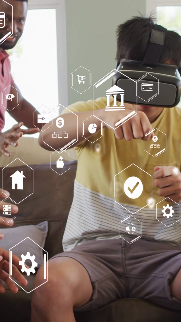 Vertical video: Man using VR headset extending arm, tapping HUD in home, companion guiding finance
