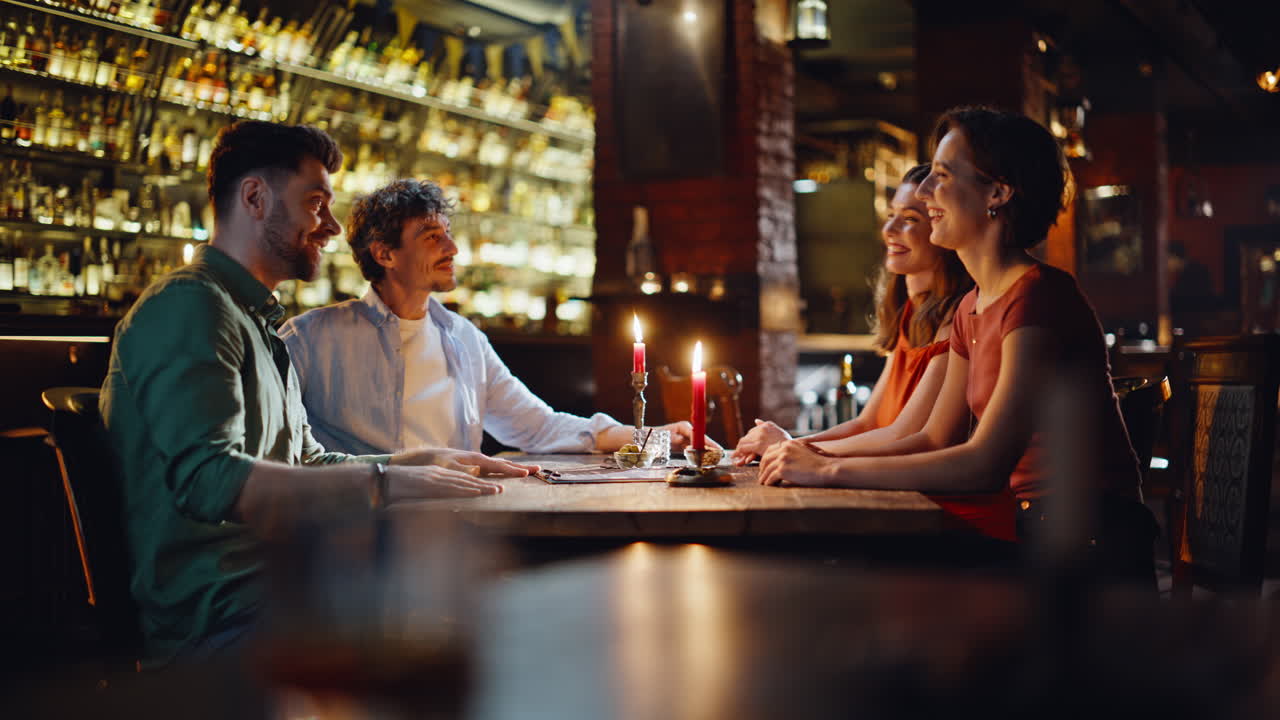 Two romantic couples dating in modern restaurant. Pair women came