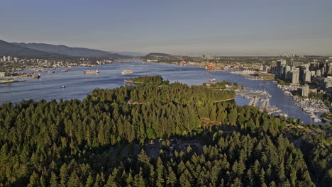 vancouver bc canada aerial v50 drone flyover stanley park capturing coal harbour downtown cityscape, marina, yacht club and north shore mountain views - shot with mavic 3 pro cine - july 2023