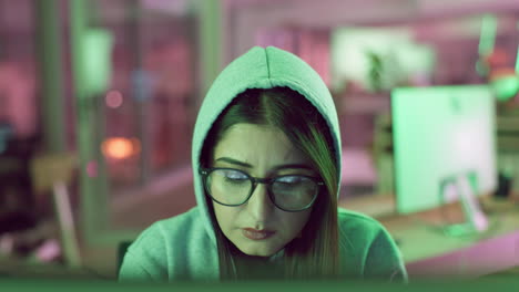Woman Concentrating on Computer at Night