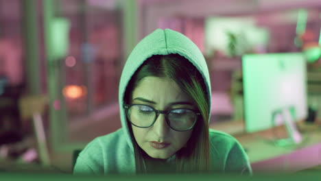 woman concentrating on computer at night