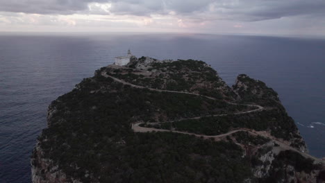 cape-Caccia,-Sardinia:-aerial-view-over-the-lighthouse-located-in-this-famous-lighthouse-and-during-sunset