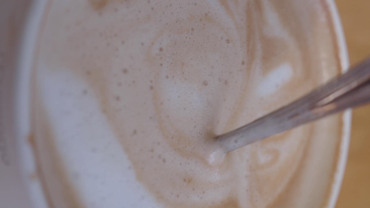 Close-up of Coffee with Foam and Spoon