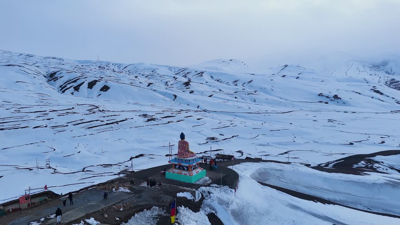 Snowy Himalayan Mountains with Buddhist Statue