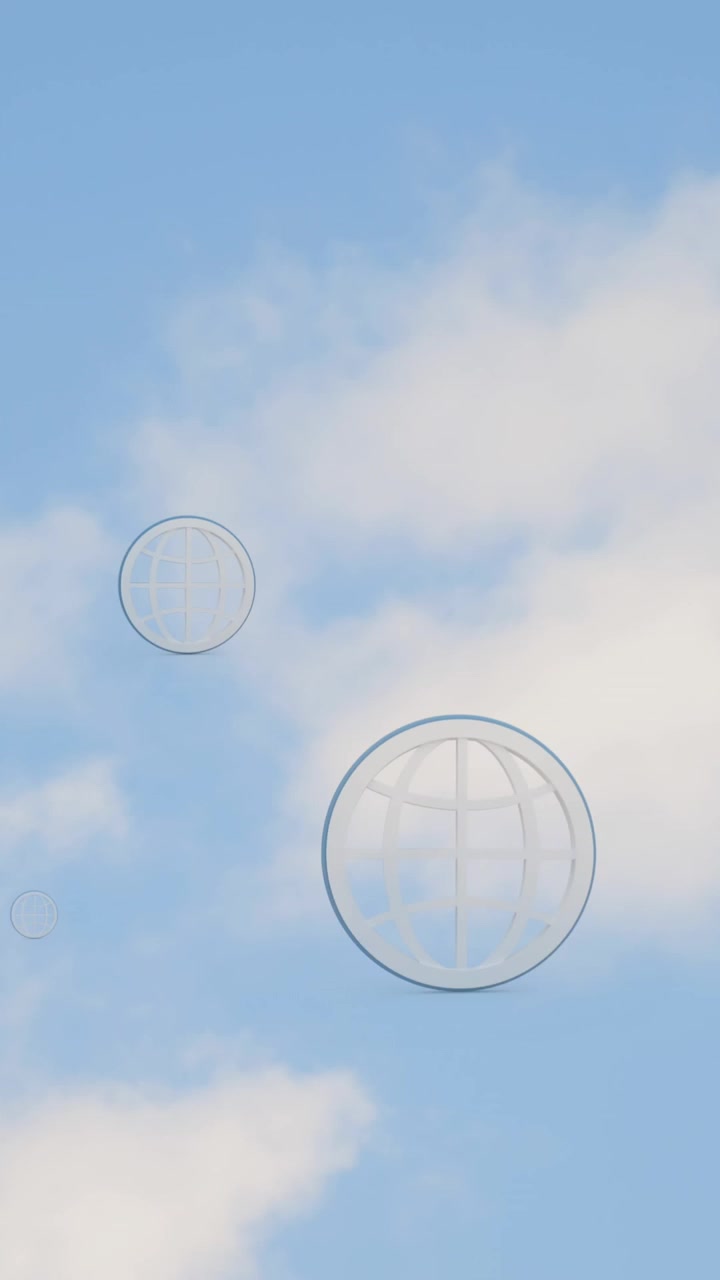 Animation of multiple web globe icons floating against tall buildings and blue sky