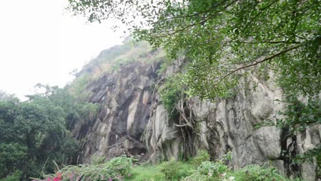 Dark-Aged-Shabby-Cliff-Face-And-Divided-By-Huge-Cracks-And-Layers