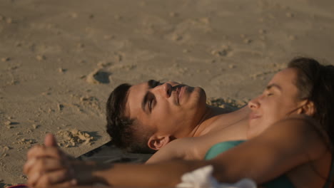 cute couple laying on the towel