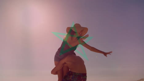 Walking on beach, couple with green star animation overlay, holding hands