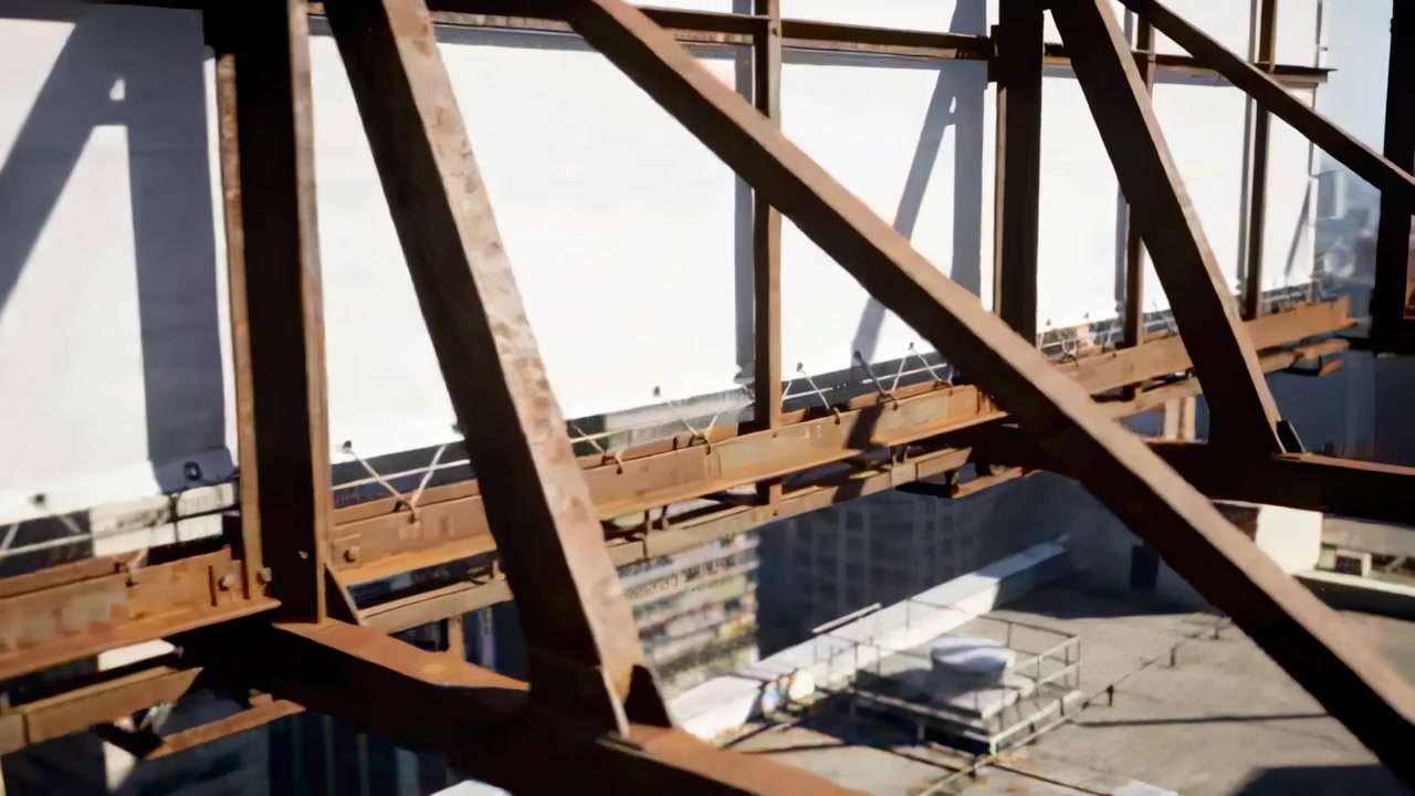 Shifting camera revealing rusted steel billboard truss at roof edge, showing HVAC and white panels