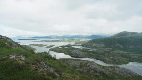 panoramic view of surrounding fjords and landscape at luroyfjellet mountain in luroy, norway