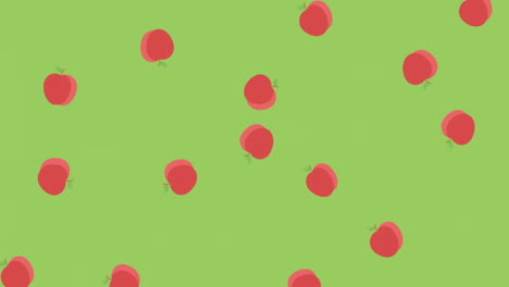 animation of red apples moving on green background