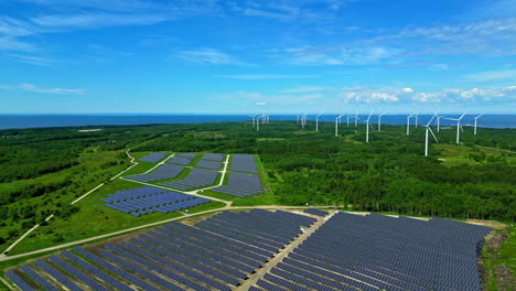 green landscape with renewable energy from solar panels and wind power plant