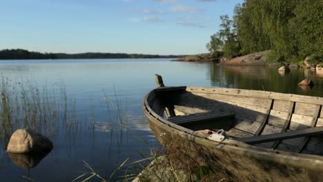 calm water and idyllic nature bay view with old wooden boat