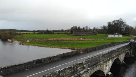 Aerial---Car-passing-through-the-bridge-accross-the-river