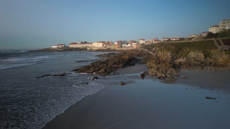 rocky shoreline of praia de arnela in caion, a coruña, spain