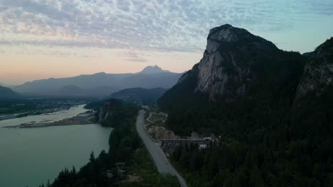 aerial dusk view of trans-canada highway, stawamus chief and mount garibaldi, squamish, bc, canada