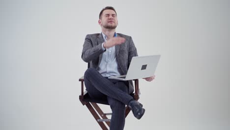 businessman with laptop in studio. studio portrait of businessman holding laptop