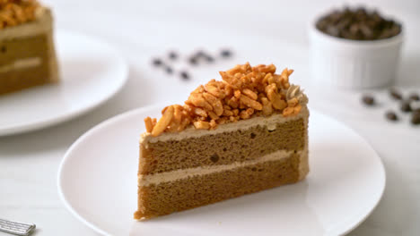 homemade-coffee-almonds-cake-on-white-plate