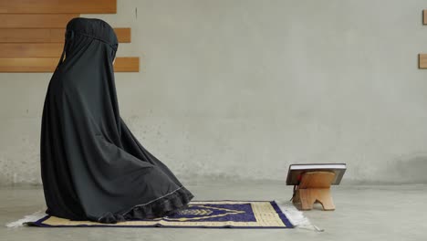 side view video of young muslim women are performing prayers. islamic religion,part 2