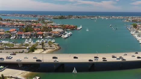 sliding aerial view of a bridge, on the pacific coast highway, in newport beach, california