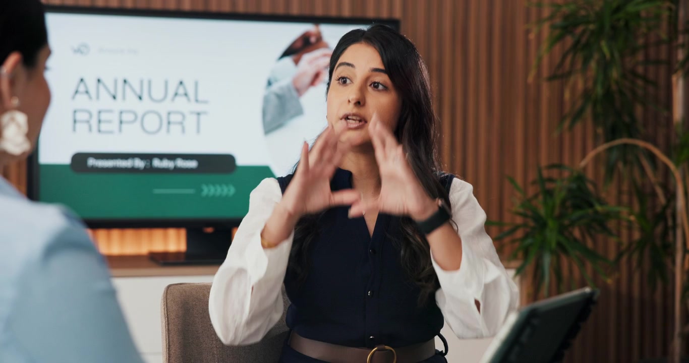 Professional Woman Presenting Annual Report in Office Meeting