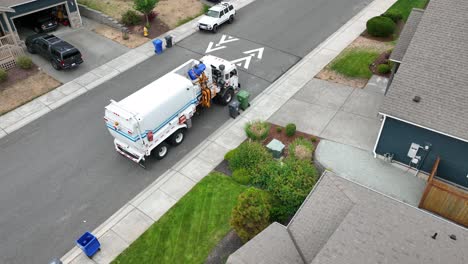 Orbiting-aerial-shot-of-a-truck-loading-a