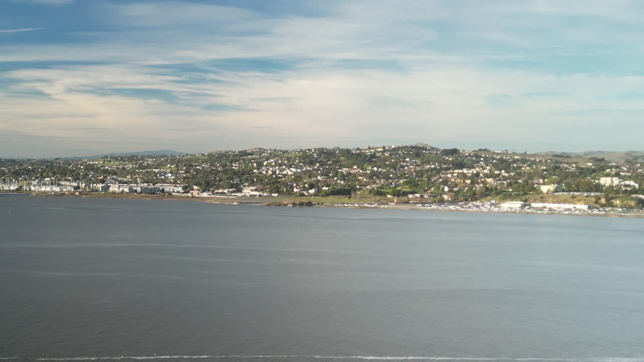 Sweeping drone orbit of Benicia’s shoreline, revealing the blend of historic charm, modern marina life, and picturesque views of the waterfront and surrounding hills.