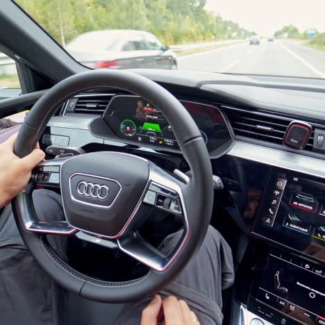 vinnitsa, ukraine - september 2019: suv audi e-tron. interior detail view with controls and steering wheel.