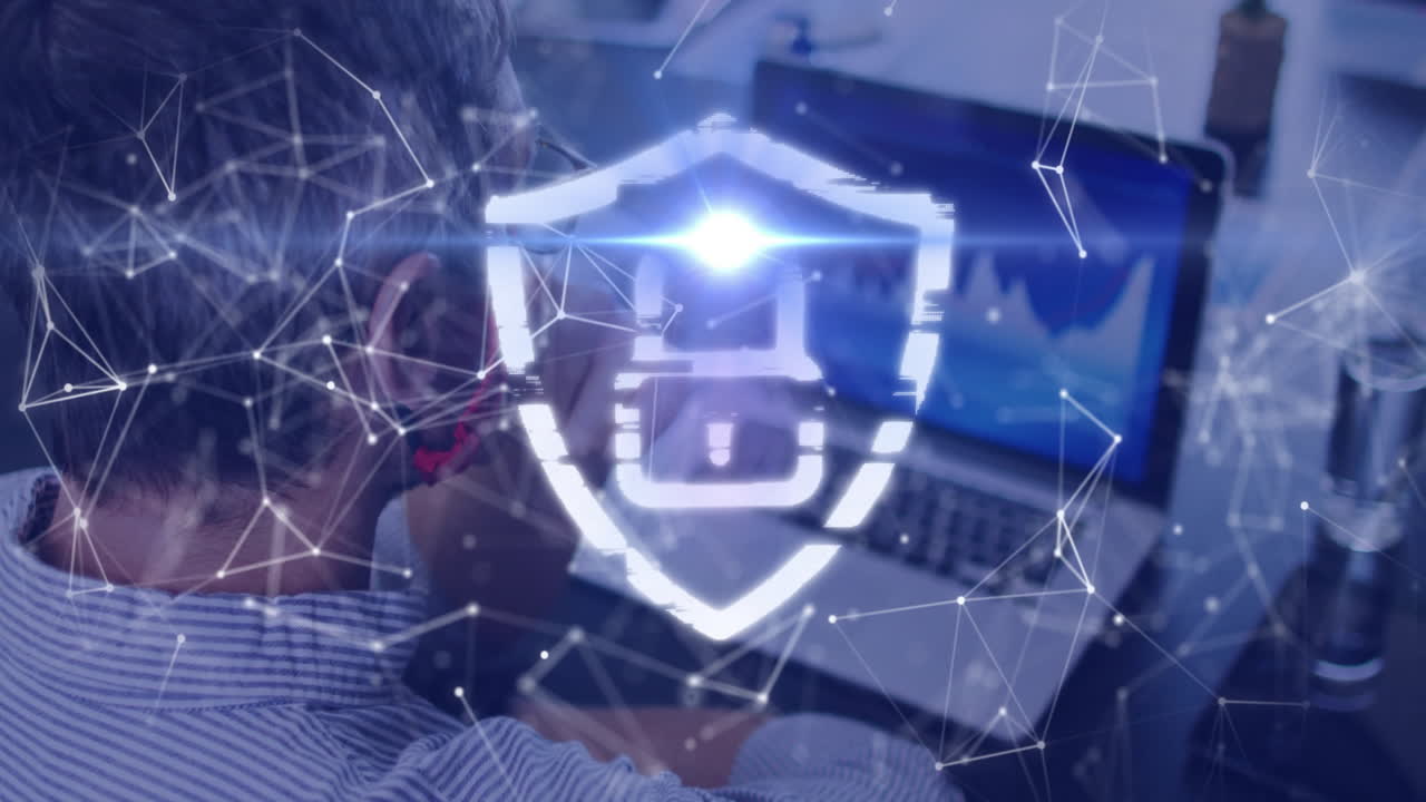 Digital shield animation over person using laptop with network connections