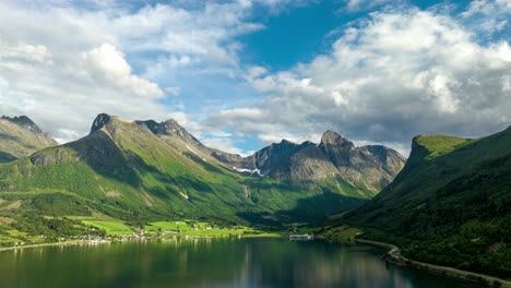 stunning skyline of clouds in motion and blue with settlement below