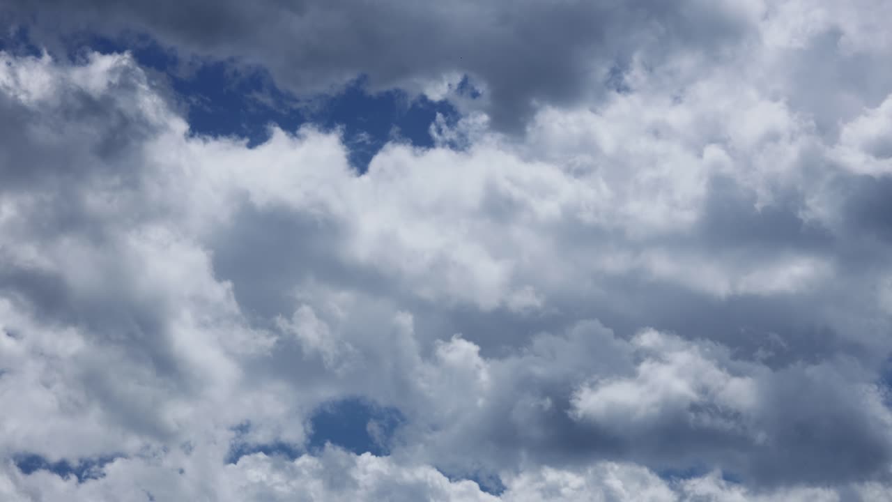 Beautiful White And Grey Clouds Rolling Against The Blue Sky. - timelapse