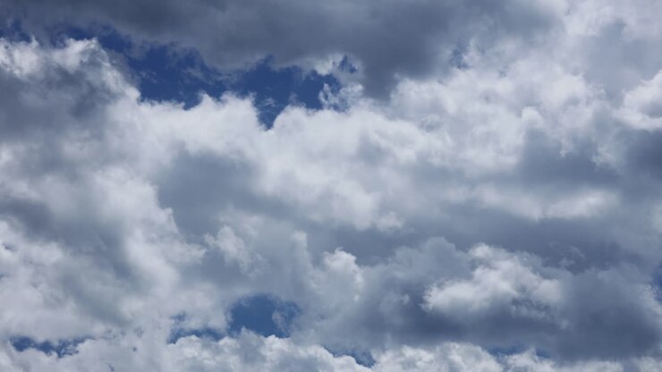 Beautiful White And Grey Clouds Rolling Against The Blue Sky. - timelapse
