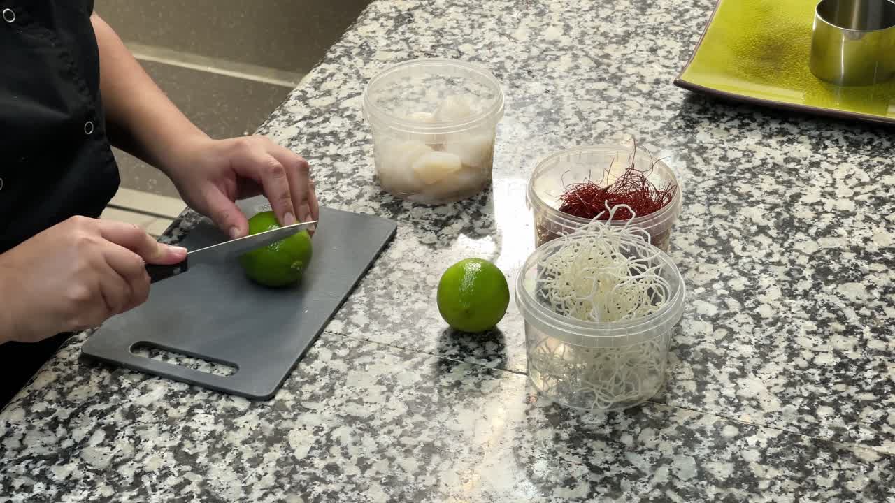 Cooker cutting a lime close up