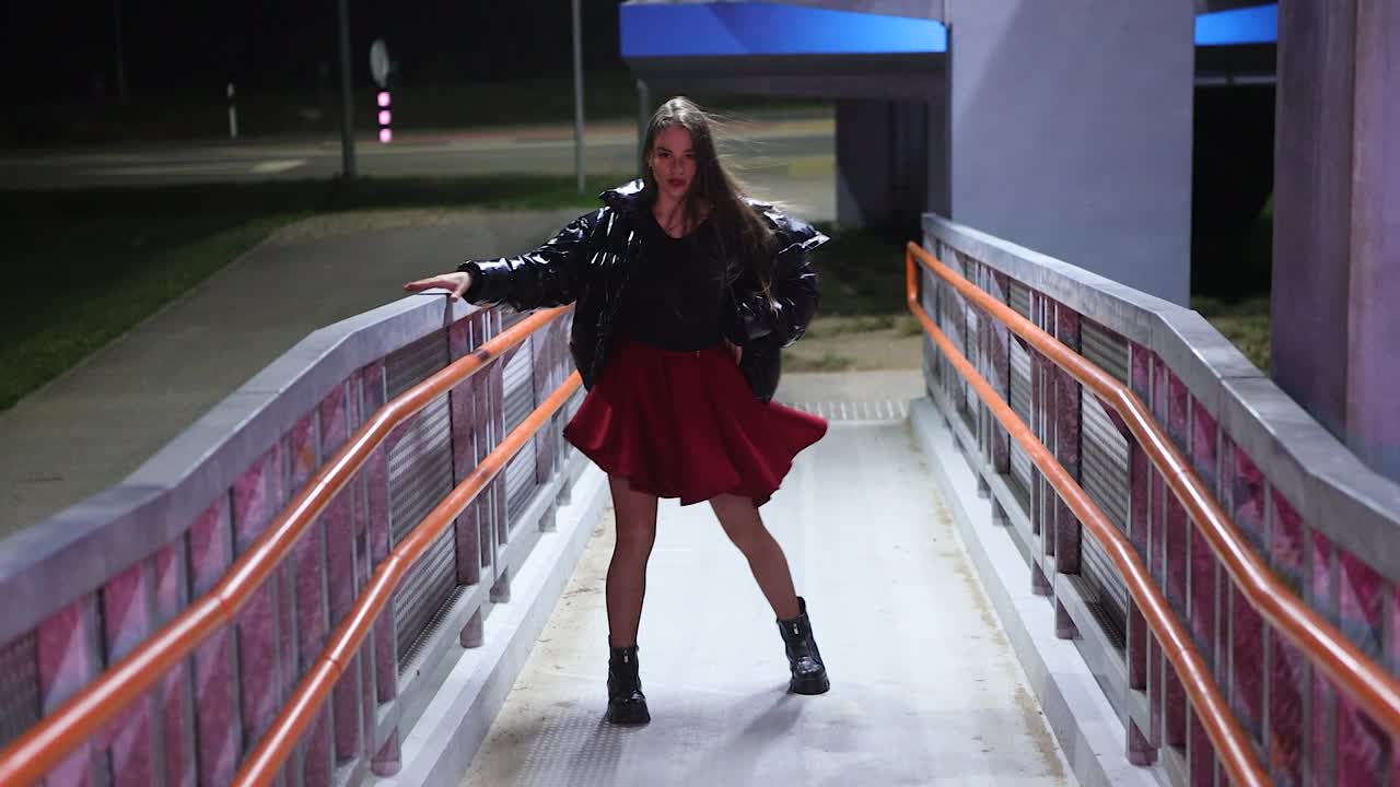 Late night dance session in slow motion young woman alone