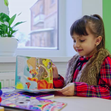 girl with book at table