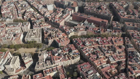 Aerial-panoramic-footage-of-buildings-in-urban-borough.-Blocks-of-residential-houses-in-city.-Barcelona,-Spain