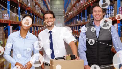 Animation-of-network-of-profile-icons-over-team-of-diverse-supervisors-smiling-at-warehouse