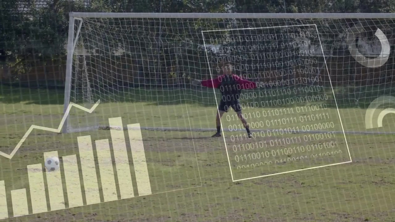 Giocatore che posiziona la palla, avviando l'HUD per lo sport, correndo e calciando mentre il portiere si tuffa, con statistiche che si aggiornano.