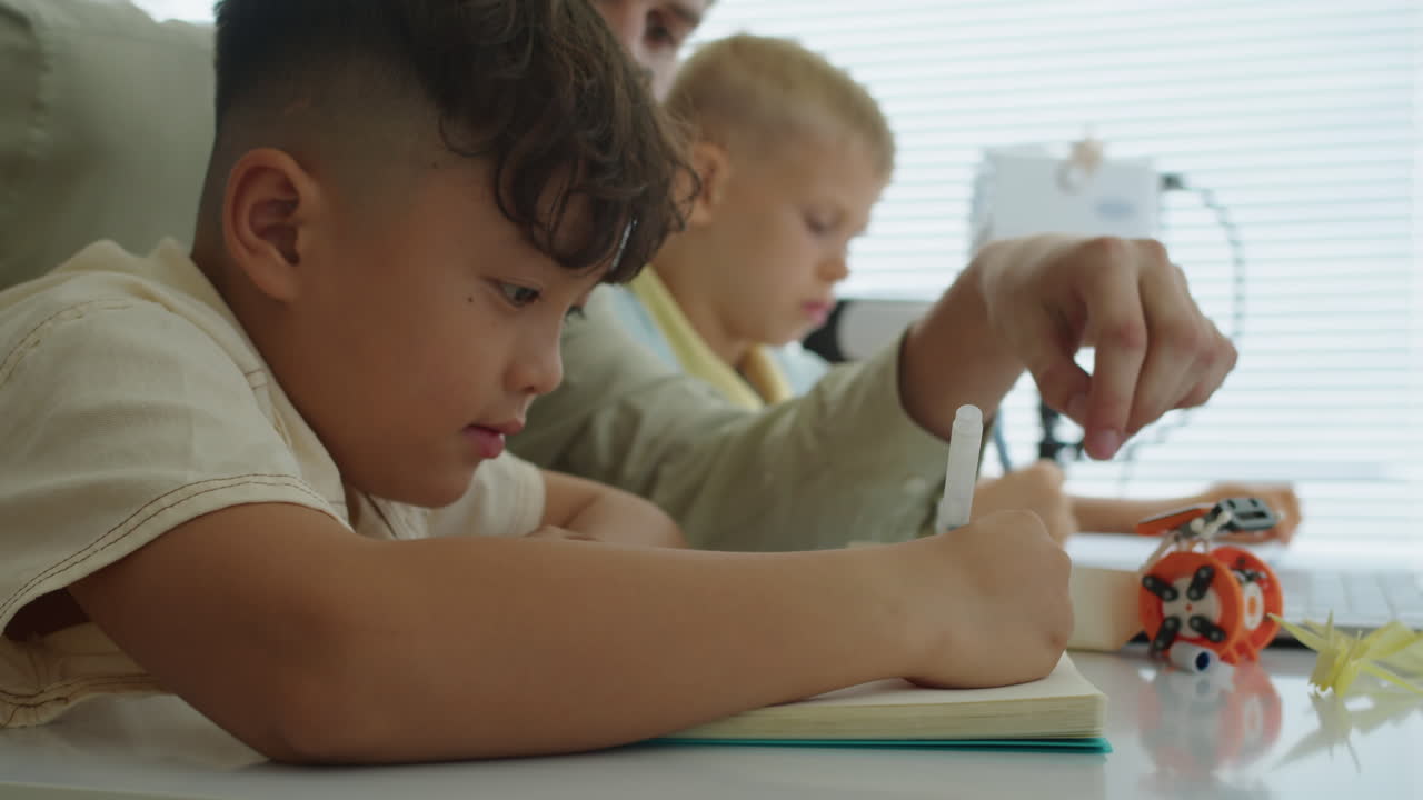Asian Boy Studying at Group Robot Engineering Class