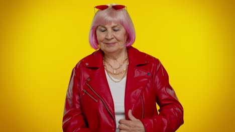 stylish senior woman in red leather jacket