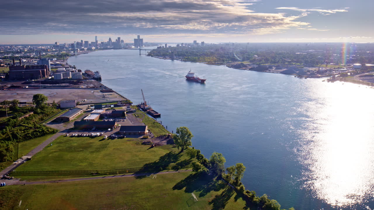 Cinematic aerial rotation of the international bridge standing between the U.S. and Canada