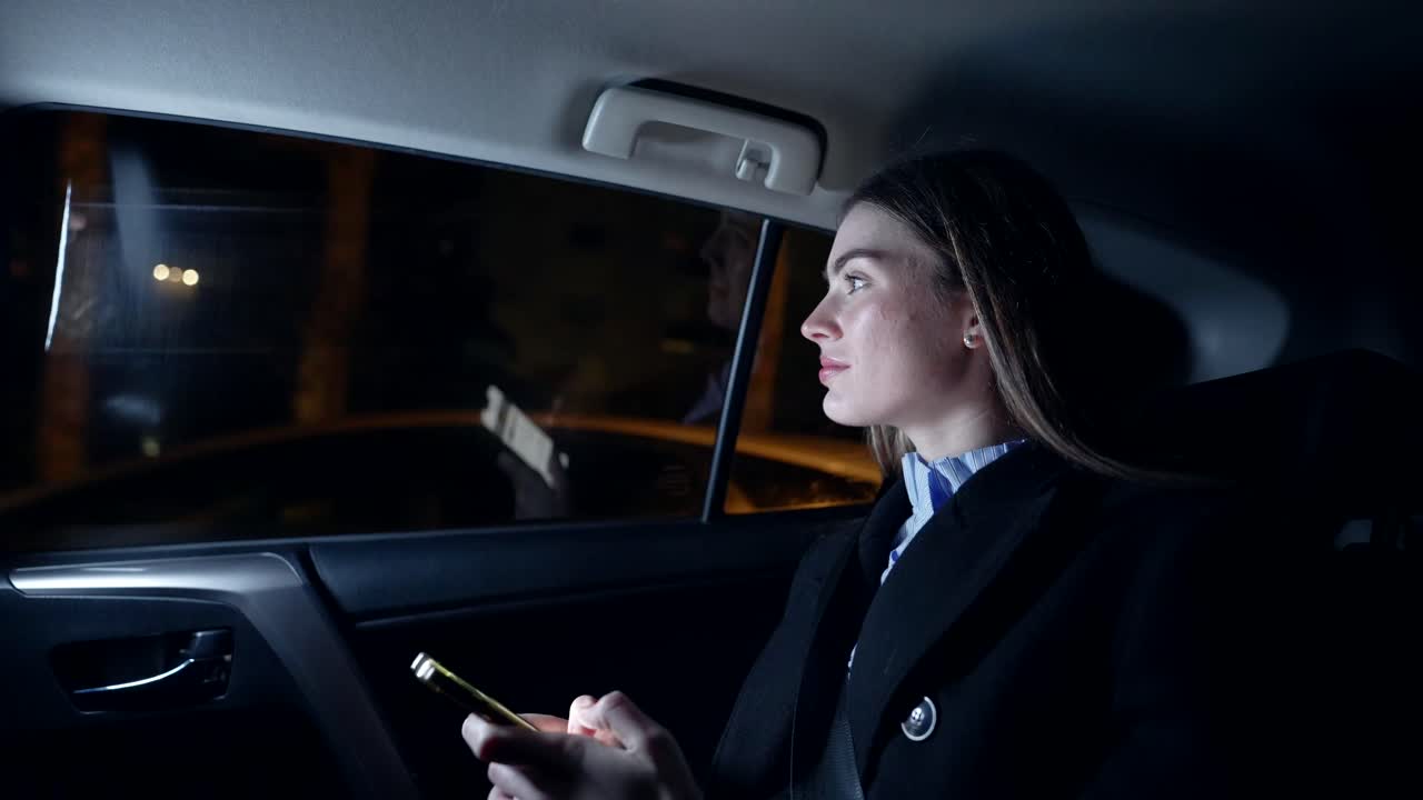 Businesswoman in a Car at Night