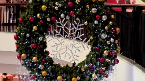 white snowflake colourful glittering baubles ornament ball decorated christmas tree. holiday winter xmas happy new year festival decoration. snowflake ball on christmas tree. merry christmas decorate